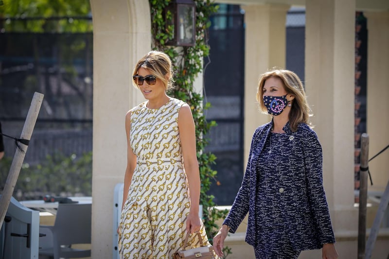 After voting, First Lady Melania Trump, left, leaves the Morton and Barbara Mandel Recreation Centre with the Palm Beach County Supervisor of Elections Wendy Sartory Link in Palm Beach, Florida on November, 3, 2020.  AFP