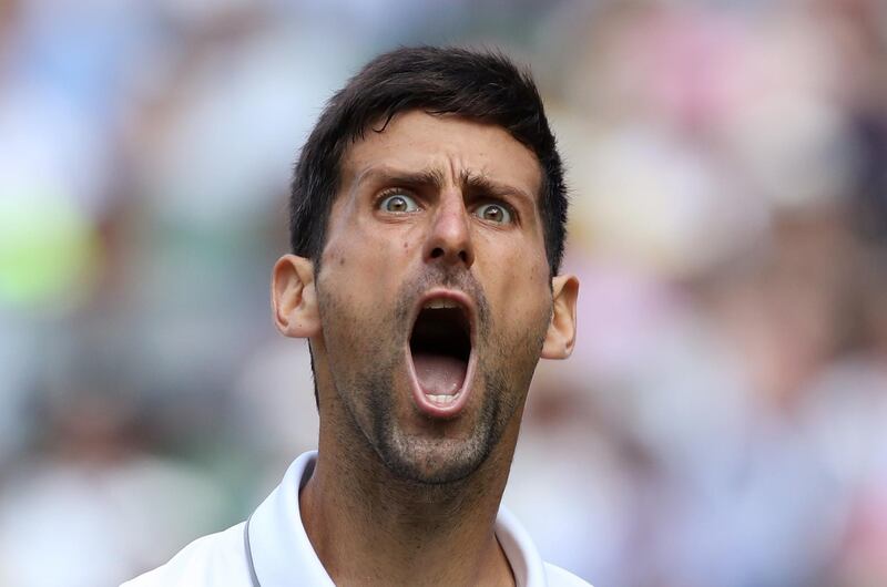 epaselect epa07712576 Novak Djokovic of Serbia in action against Roberto Bautista Agut of Spain during their semi final match for the Wimbledon Championships at the All England Lawn Tennis Club, in London, Britain, 12 July 2019. EPA/CARL RECINE / POOL EDITORIAL USE ONLY/NO COMMERCIAL SALES