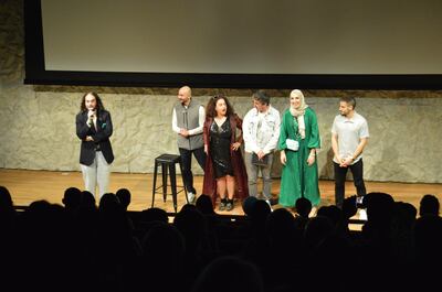 Rola Zaarour, centre, Majdy Fares, second left, and other comedians on stage after a performance. Photo: Rola Zaarour