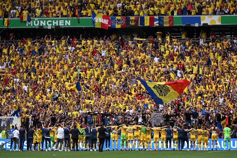 A general view as players of Romania celebrate victory in front of their fans. Getty Images