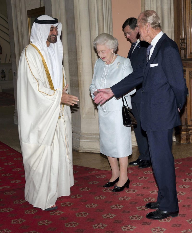 WINDSOR, ENGLAND - MAY 18: Queen Elizabeth II and Prince Philip, Duke of Edinburgh greet  The Crown Prince of Abu Dhabi, Sheikh Mohammed bin Zayed Al Nahyan as he arrives at a lunch for Sovereign Monarch's held in honour of Queen Elizabeth II's Diamond Jubilee, at Windsor Castle, on May 18, 2012 in Windsor, England. (Photo by Arthur Edwards - WPA Pool/Getty Images)