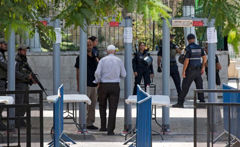 epa06103330 A Palestinian worshipper passes metal detectors installed as new security measures, at the entrance to the Al-Aqsa compound, in Jerusalem, 22 July 2017. Israeli authorities earlier had installed metal detectors at the entrance to the Al-Aqsa compound after a shooting attack carried out by Israeli Arabs on 14 July against Israeli police during which two Israeli policemen and three attackers were killed. The mufti of Jerusalem had called Palestinian Muslims not to go through the electronic gates and to reject all procedures that change the historic situation of the mosque. The measures reportedly were prohibiting Friday prayers for Muslims at the mosque for the first time in 48 years.  EPA/ATEF SAFATI