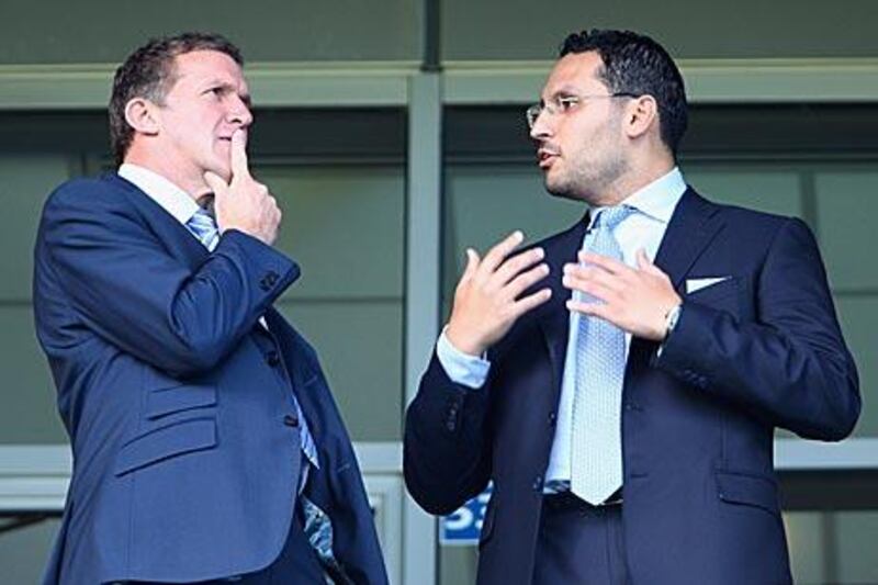 Manchester City chairman Khaldoon al Mubarak, right, and Garry Cook, the chief executive, left, will be monitoring the situation with Wayne Rooney at Manchester United.