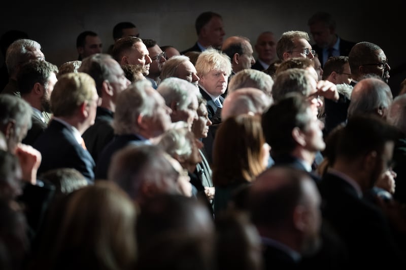 Mr Johnson listening to Ukrainian President Volodymyr Zelenskyy address parliamentarians in Westminster Hall in February. Getty Images