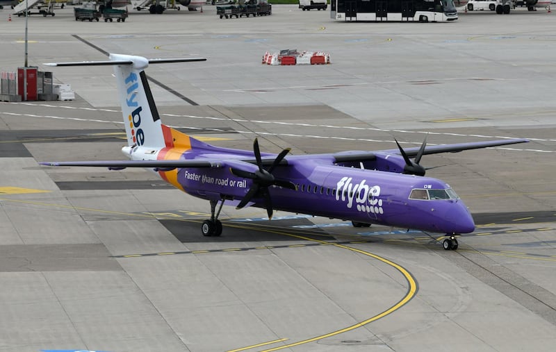 This picture shows a Dash 8 Q400 of Flybe airline on September 24, 2019 at the airport in Duesseldorf, western Germany. (Photo by INA FASSBENDER / AFP)