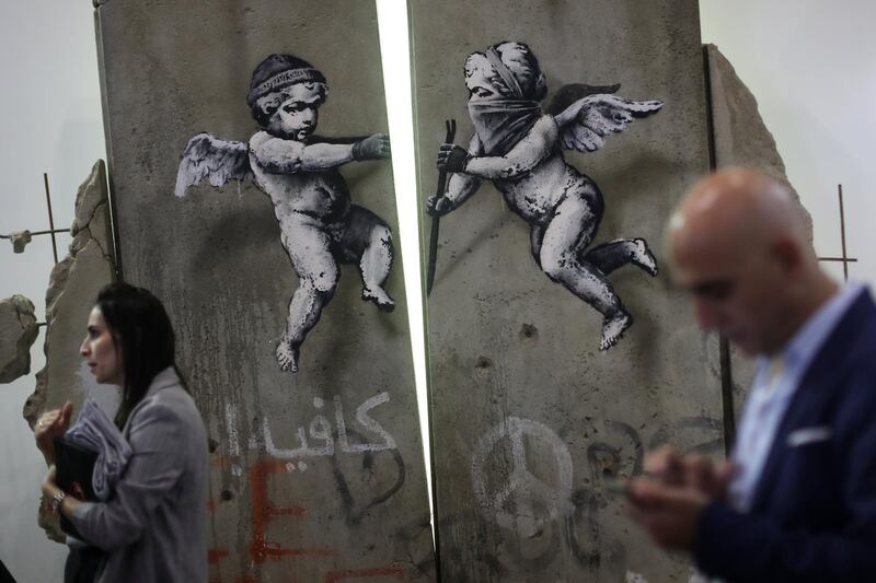 The 'replica separation barrier' created by British street artist Banksy stands. Reuters