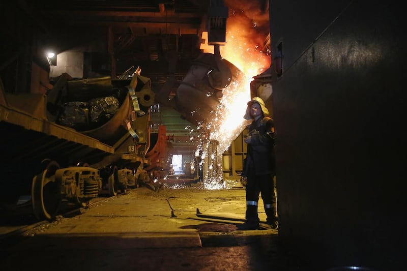 Molten steel is moved through the Metinvest Ilyich Iron and Steel Works. Rinat Akhmetov, the owner of the factory and richest man in Ukraine, has enlisted his 300,000 employees to end the turmoil unleashed by the armed takeover of pro-Russian separatists in Mairupol. John Moore / Getty Images