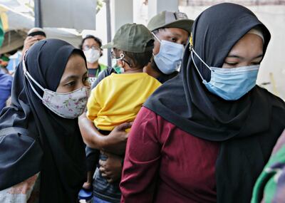 The family of Kharisma Dwi, one of the sunken KRI Nanggala-402 submarine crew members, visit a naval base in Banyuwangi, East Java Province Indonesia, April 25, 2021. REUTERS/Ajeng Dinar Ulfiana