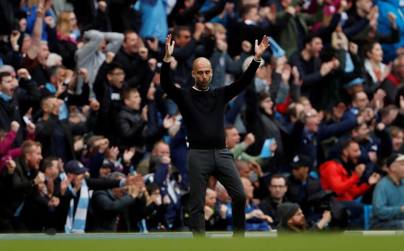 Soccer Football - Premier League - Manchester City v Swansea City - Etihad Stadium, Manchester, Britain - April 22, 2018   Manchester City manager Pep Guardiola celebrates their third goal scored by Kevin De Bruyne      Action Images via Reuters/Lee Smith    EDITORIAL USE ONLY. No use with unauthorized audio, video, data, fixture lists, club/league logos or "live" services. Online in-match use limited to 75 images, no video emulation. No use in betting, games or single club/league/player publications.  Please contact your account representative for further details.     TPX IMAGES OF THE DAY