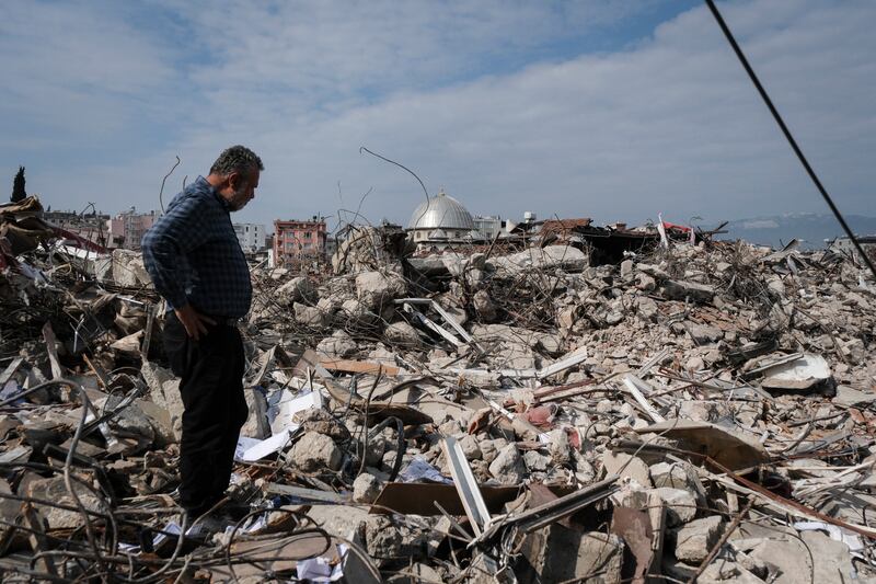 A shop owner visits the ruins of his store on February 25, 2023, in Hatay, Turkey. Getty