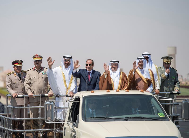 EL HAMAM, MATROUH GOVERNORATE, EGYPT - July 22, 2017: HH Sheikh Mohamed bin Zayed Al Nahyan Crown Prince of Abu Dhabi Deputy Supreme Commander of the UAE Armed Forces (3rd L), HE Abdel Fattah El Sisi, President of Egypt (4th L), HRH Prince Salman Bin Hamad Bin Isa Al Khalifah Crown Prince and First Deputy Supreme Commander of Bahrain (5th L), and HRH Prince Khalid bin Faisal bin Abdulaziz Al Saud, Governor of Makkah Region of Saudi Arabia (6th L), inspect members of the Egyptian Armed Forces during the inauguration of the Mohamed Naguib Military Base.

( Rashed Al Mansoori / Crown Prince Court - Abu Dhabi )
---