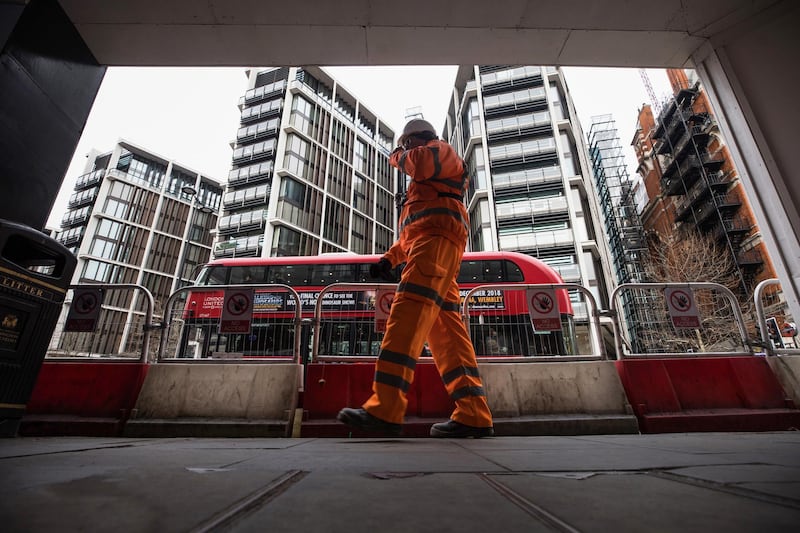 A construction worker passes the One Hyde Park luxury real estate development in London, U.K., on Wednesday, Jan. 2, 2018. Home price growth in the city has turned negative, according to a Bloomberg analysis of Land Registry data, months after analysts expected them to begin falling. Photographer: Chris Ratcliffe/Bloomberg