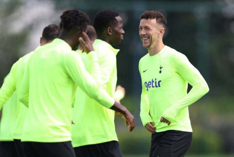Ivan Perisic of Tottenham Hotspur shares a joke with teammates. Getty Images