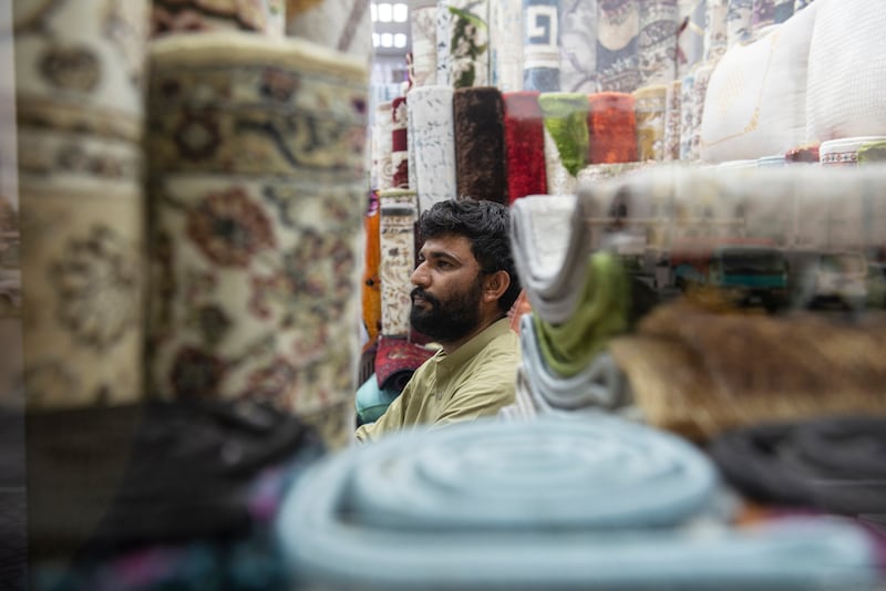 Hamin from Pakistan checks his stock to see what he needs to order.