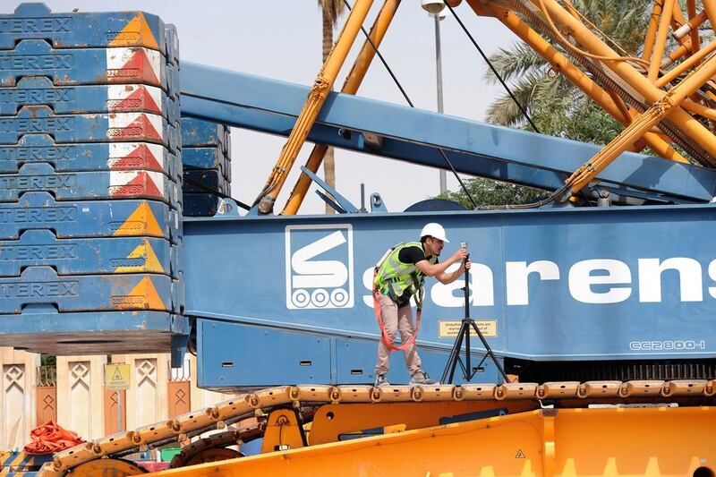 A worker takes measurement at a construction site of the Riyadh Metro. Fayez Nureldine / AFP