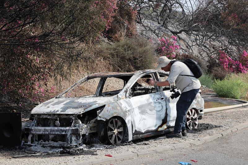 A car burnt during an infiltration by Palestinian militants from the Gaza Strip, near Sderot, Israel. AFP