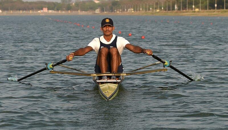 Indian rower Dattu Bhokanal takes part in a training session at the College of Military Engineering in Pune. Dattu Bhokanal, a rower from a drought-stricken village in dusty western India where residents don't have enough to drink has achieved an improbable feat – he's qualified for the summer Olympics in Rio. AFP / INDRANIL MUKHERJEE