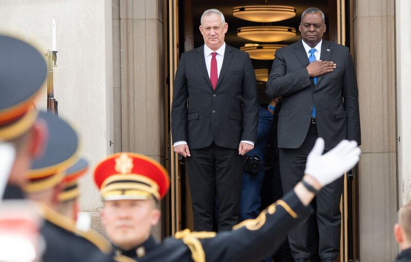 US Defence Secretary Lloyd Austin, right, and Israeli Defence Minister Benny Gantz stand for the national anthems of their countries before a meeting at the Pentagon in Washington. AFP