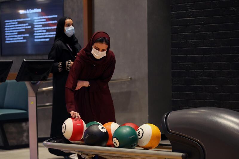 A Saudi woman wearing a protective mask bowls in Riyadh Park Mall. Reuters