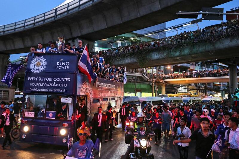 A bus carrying Leicester City players drives its way through a crowd during an open-top bus parade through the streets of Bangkok, Thailand. Dario Pignatelli / Bloomberg