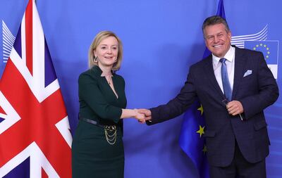 European Commissioner for Inter-institutional Relations and Foresight Maros Sefcovic, right, greets British Foreign Secretary Liz Truss before a meeting at EU headquarters in Brussels on February 21. AP