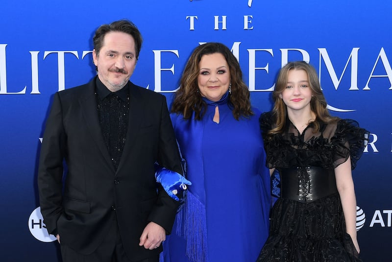 Ben Falcone, left, McCarthy, centre, and their daughter Vivian at the world premiere. AFP