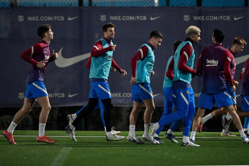 Barcelona's Spanish defender Gerard Pique and teammates take part in a training session. AFP