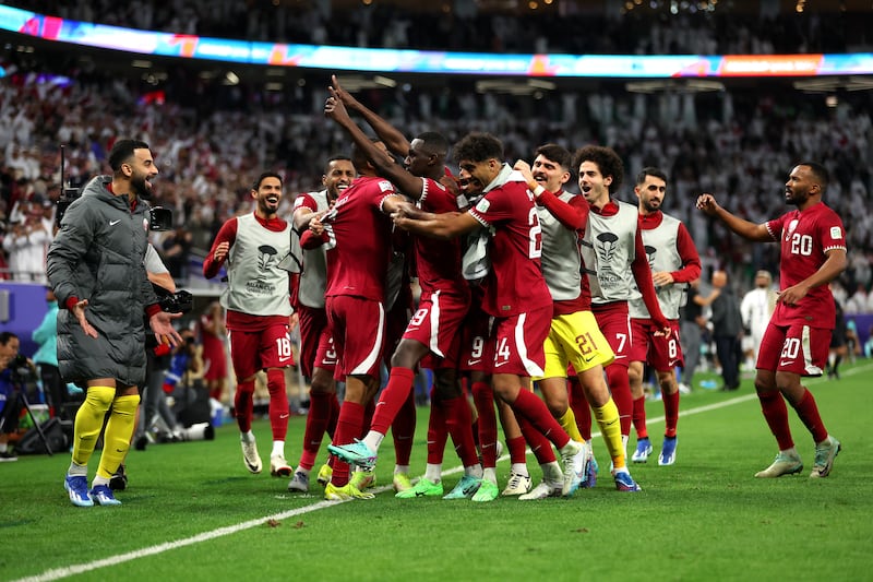 Qatar players celebrate after Ali's goal. Getty Images