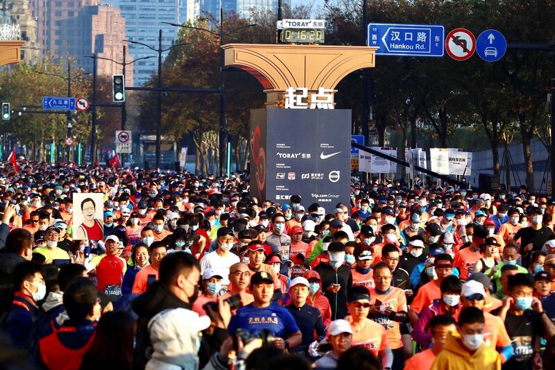 Runners take part in the 2020 Shanghai marathon. AFP