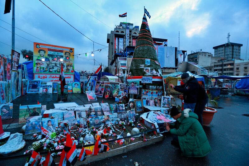 Snow starts to fall in Tahrir Square during anti-government protests. AP Photo