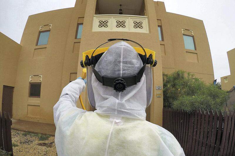 DUBAI, UNITED ARAB EMIRATES , April 11 – 2020 :- Dubai Municipality worker disinfecting the streets in Al Furjan area in Dubai. Dubai is conducting 24 hours sterilisation programme across all areas and communities in the Emirate and told residents to stay at home. UAE government told residents to wear face mask and gloves all the times outside the home whether they are showing symptoms of Covid-19 or not. (Pawan Singh/The National) For News/Online/Instagram/Standalone