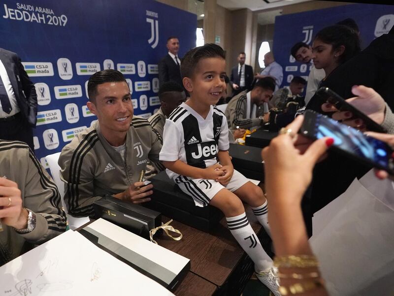 Cristiano Ronaldo of Juventus signing autographs during a meet and greet in Jeddah. Getty Images
