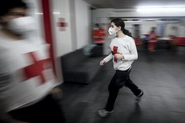 ©2021 Tom Nicholson. 23/01/2021. Jounieh, Lebanon. Lebanese Red Cross volunteer paramedics react in response to a call out during a night shift at the Jounieh station. Today Lebanon registered 4176 new Coronavirus cases, and 52 deaths. Tom Nicholson for The National