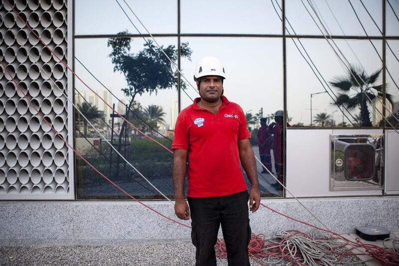 Level-3 supervisor Waheed Abdul, 34, of Pakistan, prepares to have his crew wash windows at Gate Towers on Reem Island in Abu Dhabi. Christopher Pike / The National