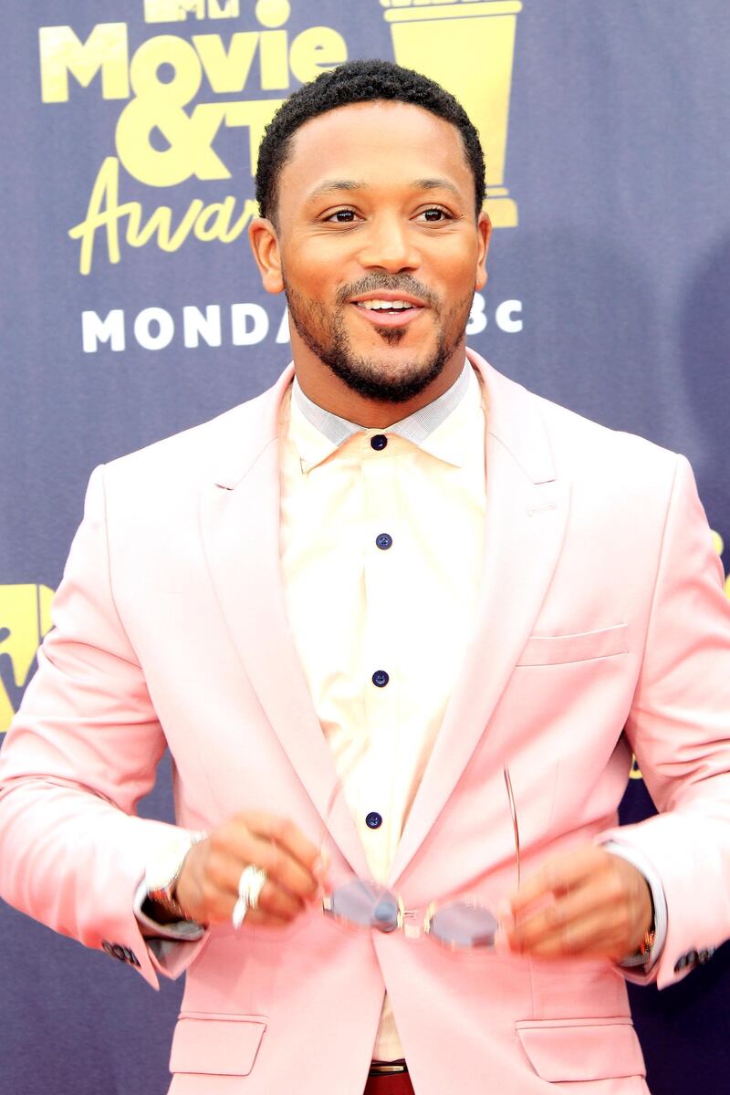 HIT
Rapper Romeo Miller stepped out in a millennial pink suit, teamed with pale pink shirt with a cut-away collar, that perfectly framed his face
