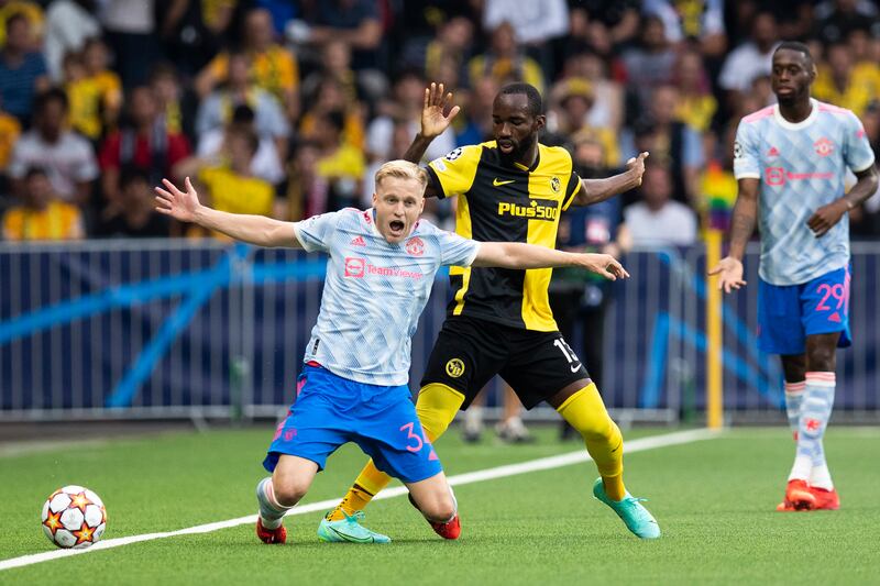 United's Donny van de Beek is fouled by  Nicolas Ngamaleu of Young Boys. AP