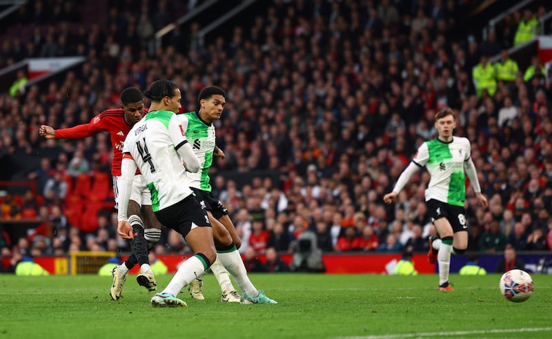 Manchester United's Marcus Rashford scores their third goal. Reuters 