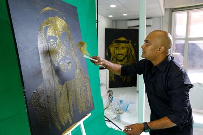 Dubai, UAE, February 8, 2015---Glitter painter, Mark Ranasinghe, in action with his rendering of H.H. Sheikh Zayed bin Sultan Al Nahyan.  Victor Besa for The National. *** Local Caption ***  VB-020815-Mark-Ranasinghe-3.jpg VB-020815-Mark-Ranasinghe-3.jpg