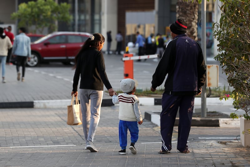 Residents in Dubai wrap up warm, with temperatures dropping to single digits in some parts of the UAE. Chris Whiteoak / The National