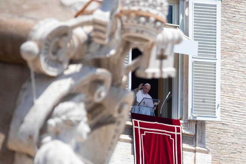 Pope Francis delivers the Angelus prayer from the window of his studio overlooking St. Peter's Square at the Vatican. AP Photo