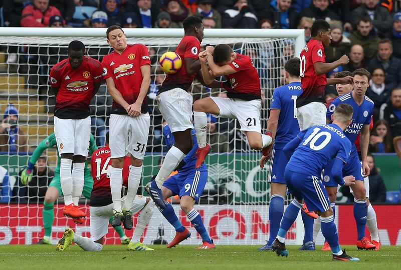 Leicester City's James Maddison, right, shoots on goal from a free-kick. EPA