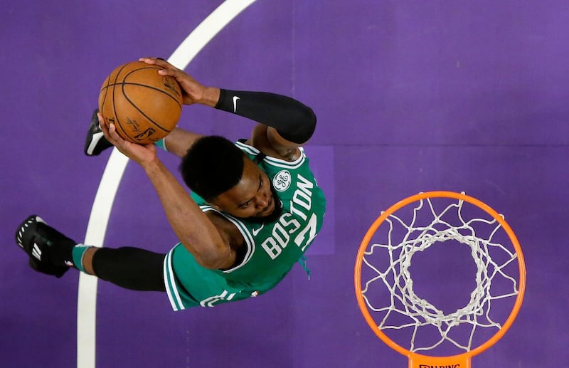 Boston Celtics guard Jaylen Brown dunks during the second half of an NBA basketball game against the Los Angeles Lakers. The Lakers won 108-107. Mark J Terrill / AP Photo