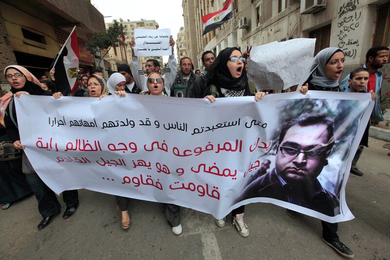 Egyptian protestors rally in support of an Egyptian lawyer sentenced to five years in prison on charges rights advocates have decried as politically motivated. AP