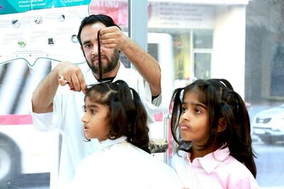 The brothers get their long hair cut for a worthy cause