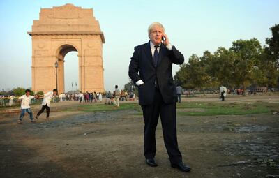 London Mayor Boris Johnson makes a phone call at India Gate in New Delhi, on the first of a six-day tour of India, where he will be trying to persuade Indian businesses to invest in London.   (Photo by Stefan Rousseau/PA Images via Getty Images)