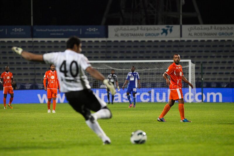 Dubai, UAE, December 5 2012: 

Al Nasr and FC Dibba battled it out tonight at the Maktoum Stadium. Unfortunately neither side had much to celebrate as the teams ended the match in a 1-1 draw.

Dibba's goal keeper, Yousef, kicks the ball upfield.
Lee Hoagland/The National