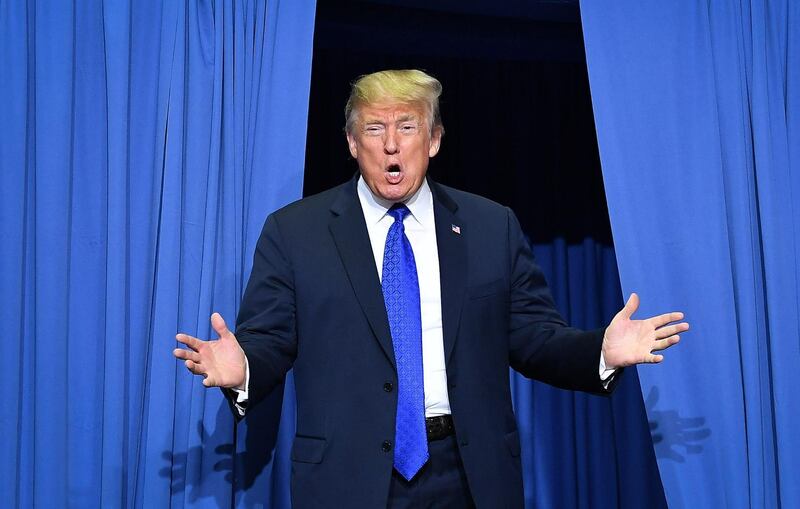 TOPSHOT - US President Donald Trump arrives at a "Make America Great Again" rally at Landers Center in Southaven, Mississippi, on October 2, 2018. / AFP / MANDEL NGAN
