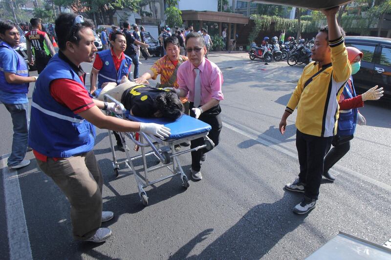 A person injured from a blast at the Indonesian Christian Church is evacuated to a waiting ambulance in Surabaya, East Java, Indonesia. Reuters