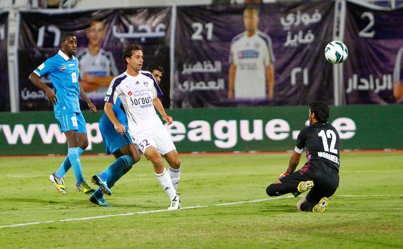 Alex Brosque of Al Ain scores his side's third goal during the Etisalat Pro League match between Dibba Al Fujairah and Al Ain at Khalifa bin Zayed Stadium, Al Ain on the 21st October 2012. Credit: Jake Badger for The National


