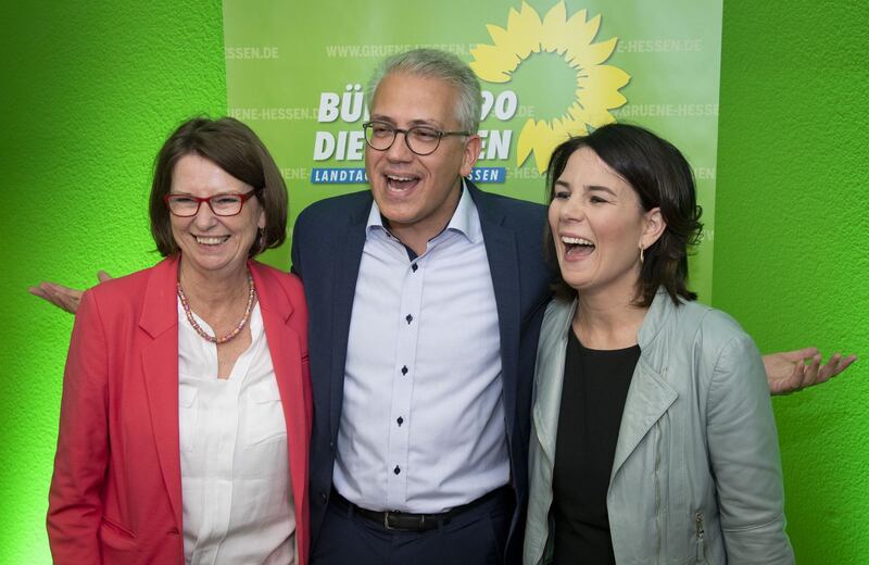WIESBADEN, GERMANY - OCTOBER 28: (L-R) Priska Hinz and Tarek Al-Wazir, the two co-lead candidates of the German Greens Party (Buendnis 90/Die Gruenen) and Annalena Baerbock, federal chairman speak to supporters after the initial election results at the Hesse state parliament that give the party 19.5% of the vote in Hesse state elections on October 28, 2018 in Wiesbaden, Germany. The Hesse election is being seen by many as a test-case for the ruling federal government coalition of German Christian Democrats (CDU/CSU) and German Social Democrats (SPD). Both parties have seen a strong decline in support in polls in recent months, while the German Greens Party has seen a surge and the right-wing Alternative for Germany (AfD) is continuing to gain states in more state parliaments across the country. (Photo by Thomas Lohnes/Getty Images)